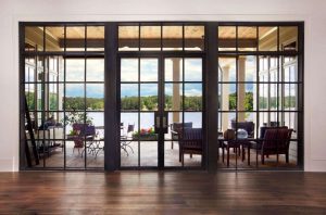bright open space with the french steel company doors and windows leading to back patio